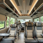 Interior mobil travel toyota hiace executive dengan reclining seat dan AC - raratravel.id